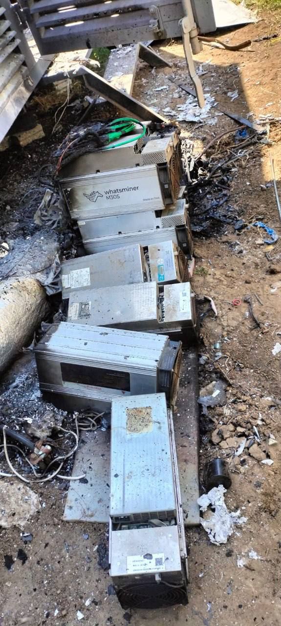 Damaged Whatsminer M30S units pulled from the fire